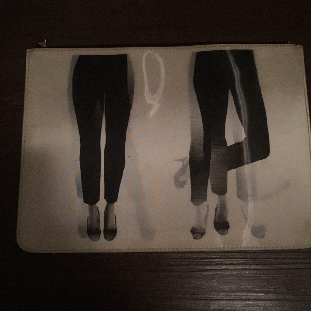 Kate spade dancing legs holographic clutch